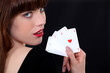 Gorgeous girl showing four aces