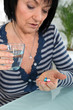 Mature woman taking drugs