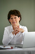 Portrait of a middle-aged woman with her laptop