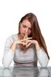 Pensive woman with her hands to her face