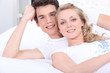 Portrait of a couple lying down