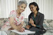 Photo: Senior woman meeting with agent Senior woman meeting with agent