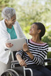 Photo: Disabled woman in a wheelchair with her mother Disabled woman in a wheelchair with her mother