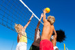 Friends playing beach volleyball