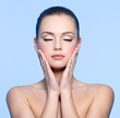 face of beautiful teen girl touching her cheeks