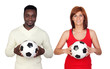 Beautiful redhead girl and attractive african men with a soccer