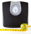 Photo: An Apple with a measuring tape and scale An Apple with a measuring tape and scale