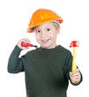 A little boy in a helmet with toy tools on white background