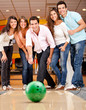 Group of friends bowling