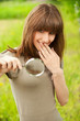 Teenager girl with magnifier