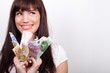 Happy young woman with her hands full of Euro bills
