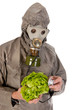 Man with gas mask and vegetables