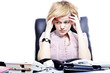 Photo: Portrait of business woman sitting at a desk in the office Portrait of business woman sitting at a desk in the office