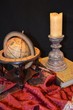 Antique globe, book and candle