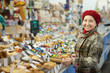 Mature woman chooses sweets