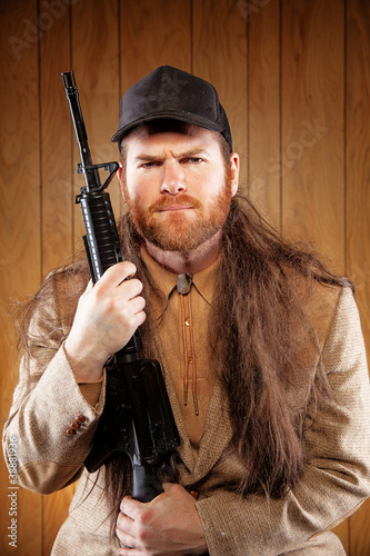 Photo: Southern Hick with a rifle and flowing hair Southern Hick with a rifle and flowing hair