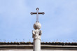 metal medieval cross on blue sky in Rome metal medieval cross on blue sky in Rome