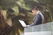 Photo: Modern businessman at the office balcony Modern businessman at the office balcony