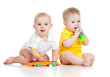 Funny boy baby  with musical toys. Isolated on white background
