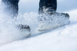 Photo: Two breaking ice skates with flying snow Two breaking ice skates with flying snow