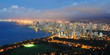 Waikiki beach by night with Honolulu in the background