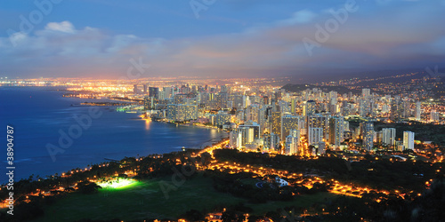 Photo: Waikiki beach by night with Honolulu in the background Waikiki beach by night with Honolulu in the background