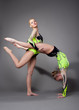 Two acrobats demonstrate skill
