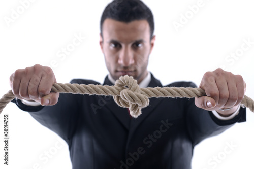 Photo: business man with rope isolated on white background business man with rope isolated on white background