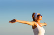 girl with arms raised towards the sky girl with arms raised towards the sky