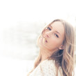 Beautiful young woman enjoying the freshness of