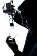 silhouette man drunk pouring empty alcohol botlle