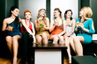 Women in club or disco drinking cocktails