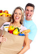 Foto: Couple with a grocery bag. Couple with a grocery bag.