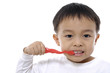 Photo: a beautiful little boy cleans your teeth- close up a beautiful little boy cleans your teeth- close up