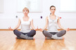 Women doing yoga exercise at gym