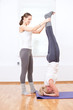Women doing yoga exercise at gym