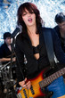 Photo: Female guitarist playing at a concert Female guitarist playing at a concert