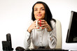Business woman in office drinking coffee