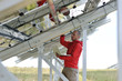 engineer using laptop at solar panels plant field engineer using laptop at solar panels plant field