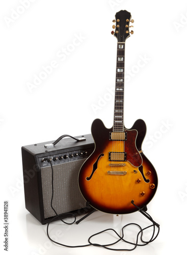 Photo: Electric guitar and amplifier on white background Electric guitar and amplifier on white background