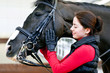 young woman with black horse
