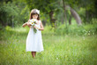 Portrait lovely girl in white with camomiles