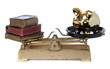scale with books and golden piggy bank