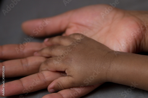 Photo: hand of a baby in his mother's hand hand of a baby in his mother's hand