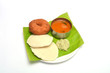 Idli vada with sambar and chutney served on banana leaf