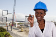 Copyspace image of woman with hard-hat making a drawing..