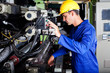 operator operating industrial printing press