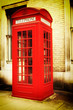 Retro image of a typical red London phone booth Retro image of a typical red London phone booth