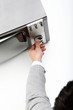 Man  turning channel knob