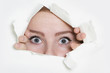 Photo: woman peeping through hole in paper woman peeping through hole in paper